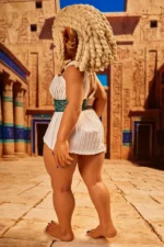 Si70 AT Kaela suntan skin goblin girl mini sex doll rear diagonal view in Egyptian white outfit head tilted down showing braided silicone hair from behind Egyptian corridor background – CLM Classic