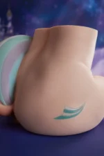 PA-Razor: This rear-quarter view highlights the product's exceptionally plump and fleshy buttocks, showcasing a smooth, delicate matte skin texture, the intricate multi-colored emblem on the right hip, and the sculpted colorful ponytail extending on the left.