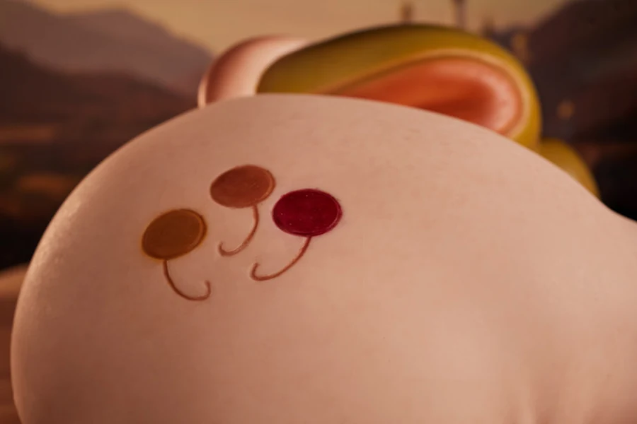 PA-Peppy: This close-up view focuses on the smooth curve of the product's hip, clearly showcasing a delicate balloon emblem composed of three reddish-yellow dots and lines on the soft, lifelike skin texture.