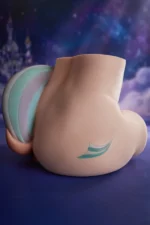PA-Razor: This rear-quarter view showcases the plump product in a sitting position, highlighting the smooth hip curves, the two-tone wing emblem on the right, and the light green and pale purple gradient tail on the left.