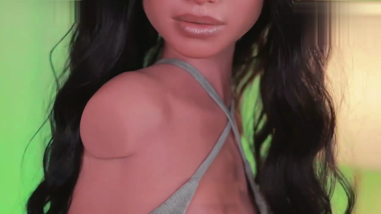 Raven shoulder and collarbone detail in a grey top