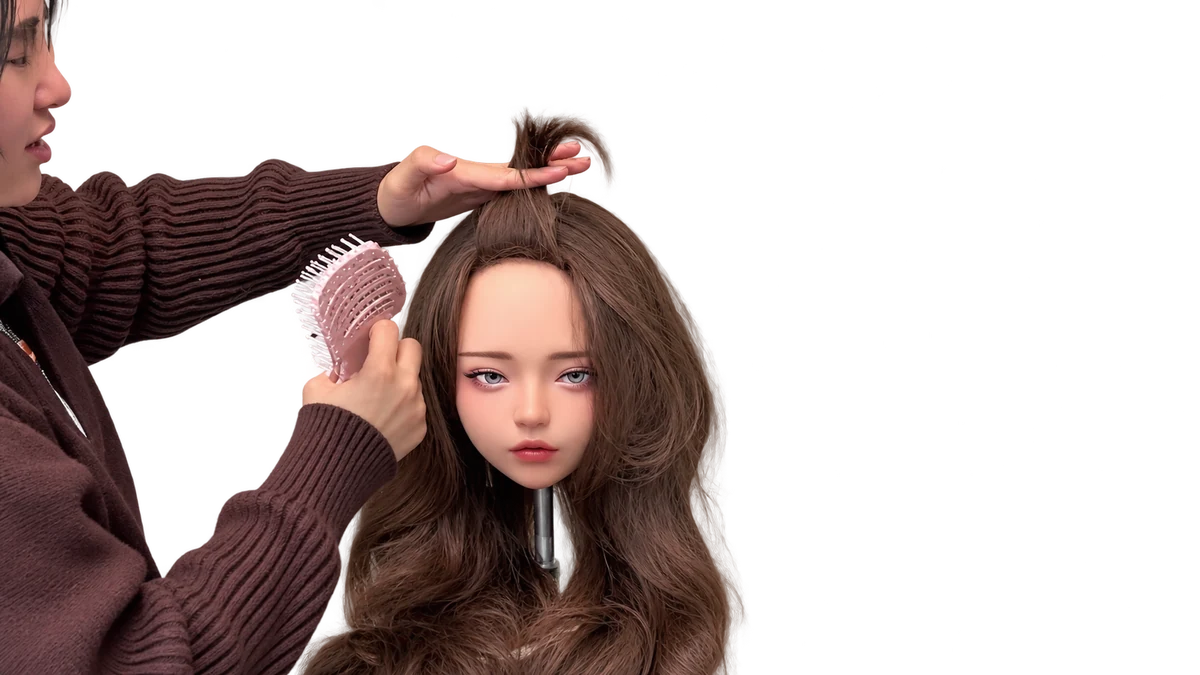 Lift a small section of bangs