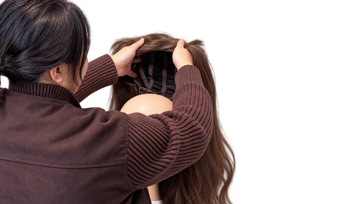 Open the cap and move the bangs aside