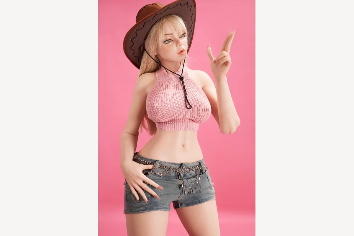 Rhea 156cm doll wearing a cowboy hat and pink top in a promotional studio photo